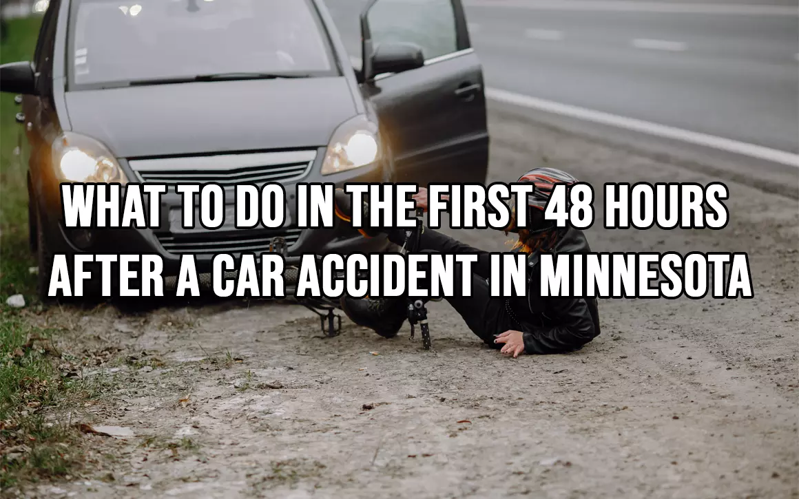 Injured motorcyclist on roadside beside fallen bike & stopped car