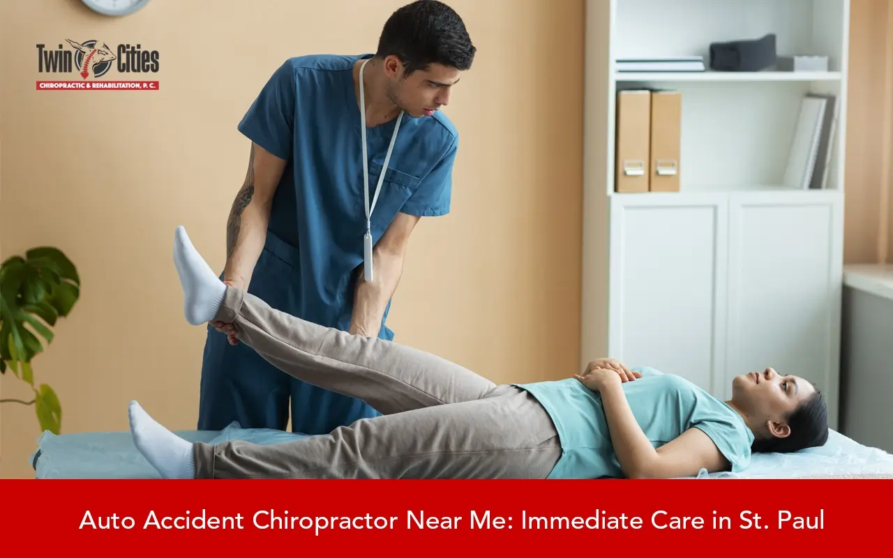 Chiropractor performing leg adjustment therapy for a patient at Twin Cities Chiropractic clinic for auto accident injury care in St. Paul.